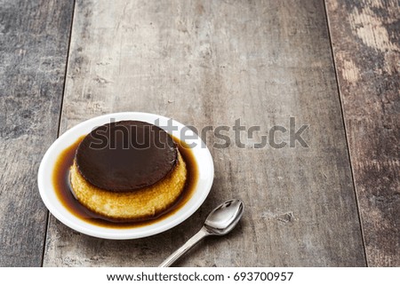 Similar – Creme caramel. Egg pudding on wooden background