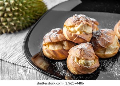 Creme Puffs Made With Fresh Durian Fresh, King Of Fruits. Typically Found In Tropical Countries Malaysia And Thailand, Durian Is A Seasonal Fruit Harvested During Summer. Homemade Food On Table.