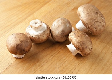 Cremini Mushrooms On Wood Surface