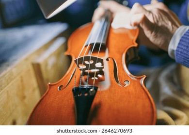 Cremona, Italy - February 6th 2025 crafting fine stringed instruments a skilled luthier working meticulously to create a violin the hands carefully shape wood for creating musical masterpieces an