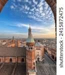 Cremona panorama of the cathedral bell tower from the Torrazzo tower at sunset. High quality photo