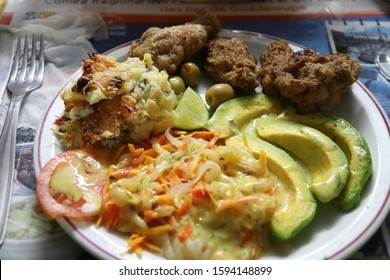 Creole Cuisine Dinner. Guadeloupe Food: Chicken With Cod Potatoes, Avocado Salad.