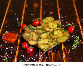 Creole Potatoes On A Black Plate. Close-up.