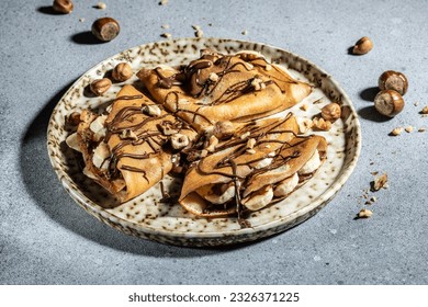 crepes with banana and chocolate. breakfast or dessert. banner, menu, recipe place for text, top view. - Powered by Shutterstock