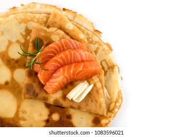 Crepes with Raw Sliced Salmon Fillet Top View. Thick Pieces of Red Trout with Pancakes Isolated