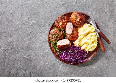 Crepinette, Fried Flat Sausages Or Patties Of Minced Meat And Wrapped In A Caul Fat, Served On A Plate With Potato Mash And Red Cabbage Salad, French Cuisine, View From Above, Free Space