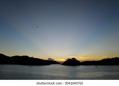 Crepuscular Ray In Hong Kong. Sunset