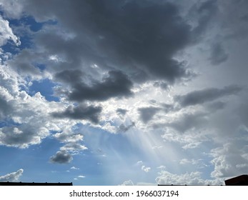Crepuscular rays occur when objects such as mountain peaks or clouds partially shadow the sun's rays - Powered by Shutterstock - Get 15% off with code: PIKWIZARD15