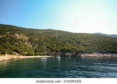 Cres Island, Istria Croatia: View From The Water To The Beach And Sailing Boat At Adriatic Sea Near Village Valun