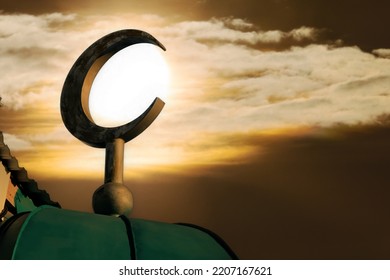 Crescent against sun and evening sky. Symbol of Islam and Ramadan. Symbol islamic religion. Muslim background with copy space - Shutterstock ID 2207167621
