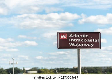 Crescent Beach, Florida with Atlantic Intracoastal Waterway sign that extends more Norfolk, VA to Key West, FL on sunny day with clouds in blue sky