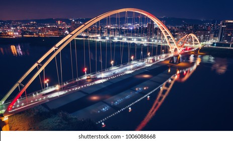 Crescent Bridge - Famous landmark of New Taipei, Taiwan with beautiful illumination at night, aerial photography in New Taipei, Taiwan.