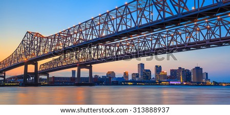 The Crescent City Connection Bridge on the Mississippi river and downtown New Orleans Louisiana