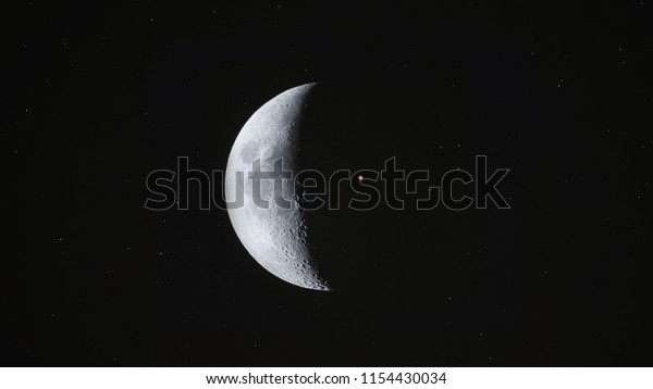 Crescent Moon background / The Moon is an\
astronomical body that orbits planet Earth and is Earth\'s only\
permanent natural satellite. It is the fifth-largest natural\
satellite in the Solar\
System