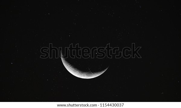 Crescent Moon background / The Moon is an
astronomical body that orbits planet Earth and is Earth's only
permanent natural satellite. It is the fifth-largest natural
satellite in the Solar
System