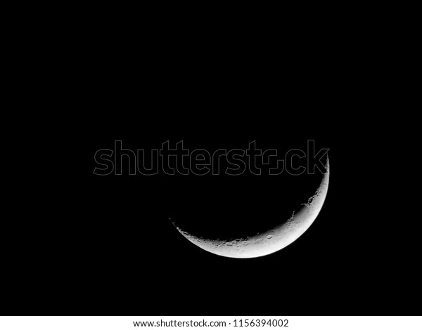 Crescent\
moon background / A crescent shape is a symbol or emblem used to\
represent the lunar phase in the first\
quarter