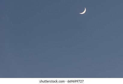 Crescent moon with a beautiful blue sky in the background. - Shutterstock ID 669699727