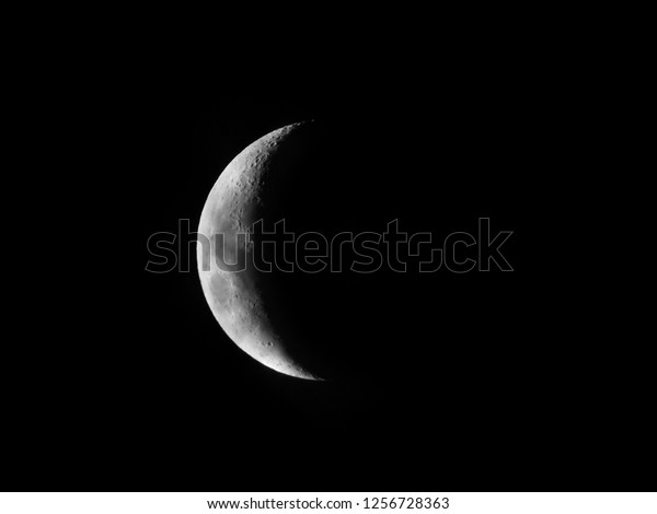 Crescent Moon five day old / The Moon as it appears
early in its first quarter or late in its last quarter, when only a
small arc-shaped section of the visible portion is illuminated by
the Sun
