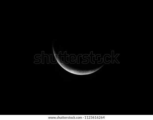 Crescent moon / The lunar phase or phase of the\
Moon is the shape of the directly sunlit portion of the Moon as\
viewed from Earth