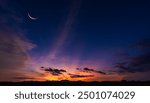 Crescent moon on dusk sky sunset after sun down twilight over hill, Horizon landscape countryside,Religion of Islamic and free space for text Arabic