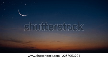 Crescent moon on dusk sky twilight after sundown, religion of Islamic well editing text Ramadan Kareem, Eid al Fitr, Eid Mubarak, Eid Al Adha, Muharram on free space background 