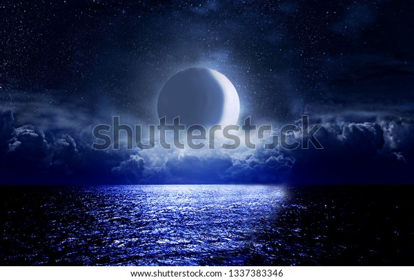 Crescent moon over the sea at\
night