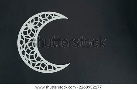 Crescent moon shape on a dark colour background, Arabic pattern image