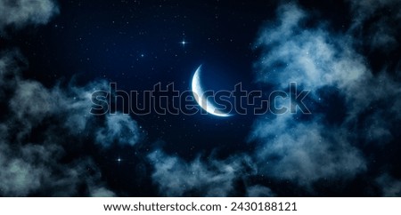 Crescent moon, shining stars and thin clouds in the calm midnight sky. Bottom up view of mysterious night sky view that gives calmness