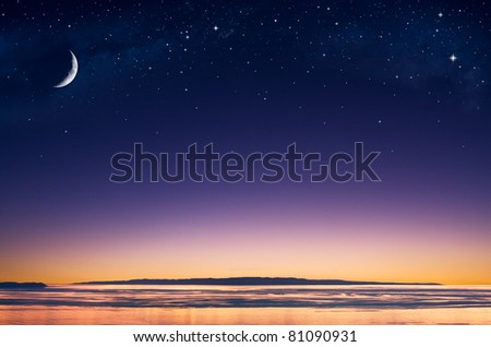 A crescent moon and stars over an island in the Pacific ocean just after sunset.