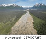 Crescent River or Red River in Lake Clark National Park and Preserve in Alaska. River originates from glaciers and drain into Cook Inlet. Braided river rich with sediment. Chigmit Mountains.