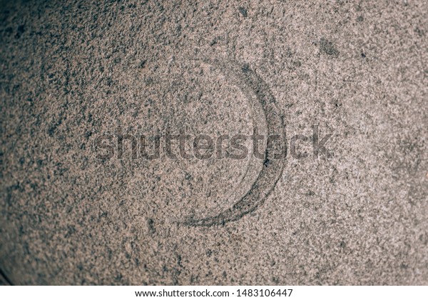 A crescent sign carved on a stone. Heavenly\
sign on granite. Stone\
engraving