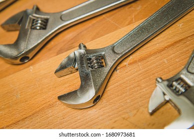 Crescent Wrench Close Up On Wood Work Bench Overhead View