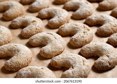 Crescent-shaped Christmas Cookies On The Baking Sheet (vanilla Crescents)