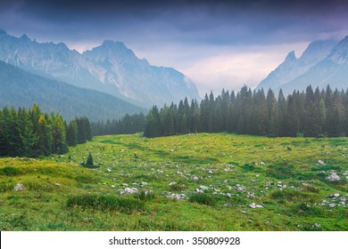 Cresta di Enghe mountain range at foggy summer morning. Dolomites mountains, Italy, Europe. - Shutterstock ID 350809928