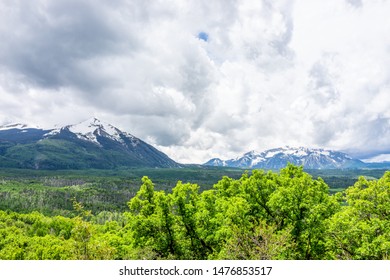 Crested Butte Snow Mountain View From Kebler Pass With Cloudy Sky In Green Summer