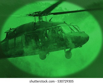 Crestview, Florida, USA - May 7, 2011: A UH-60 Blackhawk operated by the Army Rangers lands in a training mission, as seen through night vision goggles (NVGs)