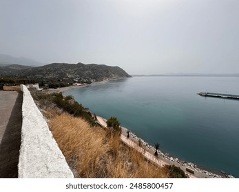 Crete's landscape is a captivating blend of rugged mountains, pristine beaches, and fertile valleys. Olive groves dot the hillsides, while ancient ruins and charming villages punctuate the terrain. - Powered by Shutterstock