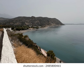 Crete's landscape is a captivating blend of rugged mountains, pristine beaches, and fertile valleys. Olive groves dot the hillsides, while ancient ruins and charming villages punctuate the terrain. - Powered by Shutterstock