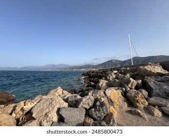 Crete's landscape is a captivating blend of rugged mountains, pristine beaches, and fertile valleys. Olive groves dot the hillsides, while ancient ruins and charming villages punctuate the terrain. - Powered by Shutterstock