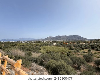 Crete's landscape is a captivating blend of rugged mountains, pristine beaches, and fertile valleys. Olive groves dot the hillsides, while ancient ruins and charming villages punctuate the terrain. - Powered by Shutterstock