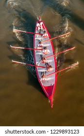 Crew In Action On A Rowing Boat During A Competition