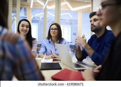 Crew Of Professional Male And Female HR Managers Conducting Interview With Young Trainees Explaining Details Of Working Process Asking Questions About Skills, Creative Designers Using Technology 
