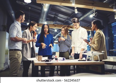 Crew of skilled journalists communicating during morning meeting in newsroom discussing ratings of publications monitoring feedbacks via digital devices and wireless connection to fast 4G internet - Powered by Shutterstock