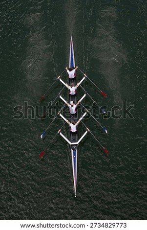 Crew Team Rowing in Competition