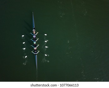 Crew Team Rowing On A Lake