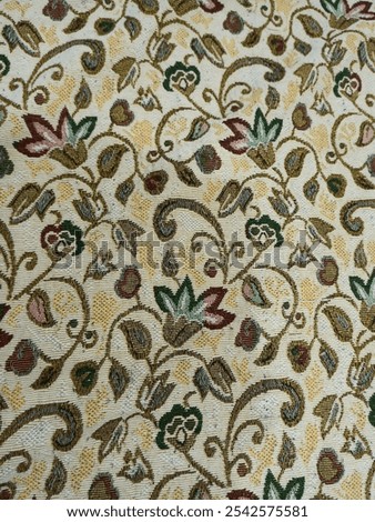 Crewel fabric features wool yarn embroidery on a base fabric, often cotton or linen. This embroidery technique creates intricate designs, usually depicting floral or natural scenes. 
 