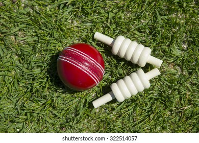 Cricket Ball And Bails On Oval