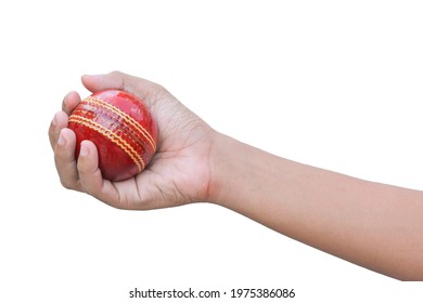 The cricket ball in the hand of a popular young athlete isolated on white background. This has clipping path. - Powered by Shutterstock