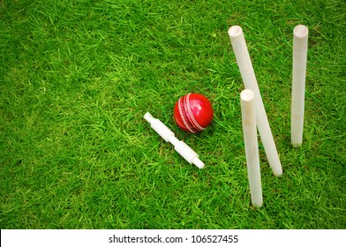 cricket ball on pitch after hitting stumps with copy space