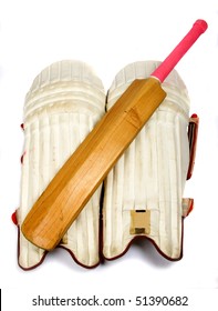 Cricket bat bright pink handle with leg pads for batting.